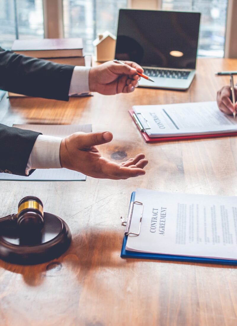 business people and lawyers discussing contract papers.Legal planning. Concepts of law, advice, legal services business people and lawyers discussing contract papers.Legal planning. Concepts of law, advice, legal services